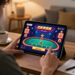 Player using GK88 app on tablet for live dealer game, focused and engaged in responsible gaming.